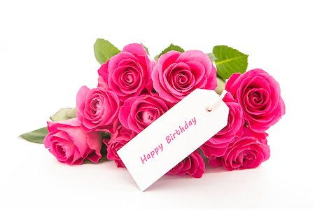 simsearch:400-06877945,k - Close up of a bouquet of pink roses with a happy birthday blank day card on a white background Stock Photo - Budget Royalty-Free & Subscription, Code: 400-06877949