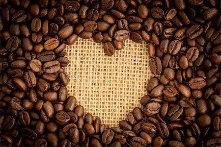 Heart shaped indent in pile of coffee beans on burlap sack Stock Photo - Budget Royalty-Free & Subscription, Code: 400-06878363