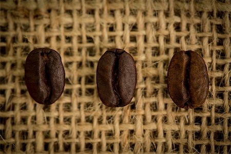 row of sacks - Three coffee beans in a row on a burlap sack Stock Photo - Budget Royalty-Free & Subscription, Code: 400-06878376