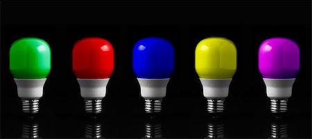 Colored light bulbs in row against black background Stock Photo - Budget Royalty-Free & Subscription, Code: 400-06878572