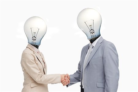 Business people with lightbulb heads greeting with a handshake against white background Stock Photo - Budget Royalty-Free & Subscription, Code: 400-06878581