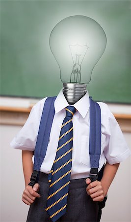 Pupil with light bulb instead of head in classroom Stock Photo - Budget Royalty-Free & Subscription, Code: 400-06878658
