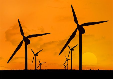 simsearch:400-07220226,k - Wind turbines with a sunset one behind the other in two lines Stockbilder - Microstock & Abonnement, Bildnummer: 400-06878727