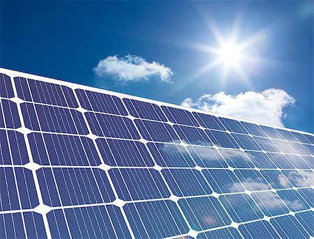 panel solar - Solar panel reflecting sunlight against a blue sky Stock Photo - Budget Royalty-Free & Subscription, Code: 400-06878735