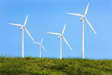 electric turbine front - Four turbines on the grass against blue background Stock Photo - Budget Royalty-Free & Subscription, Code: 400-06878746