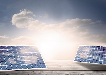 simsearch:693-03312761,k - Solar panels standing on floorboards in the cloudy blue sky Stock Photo - Budget Royalty-Free & Subscription, Code: 400-06878850