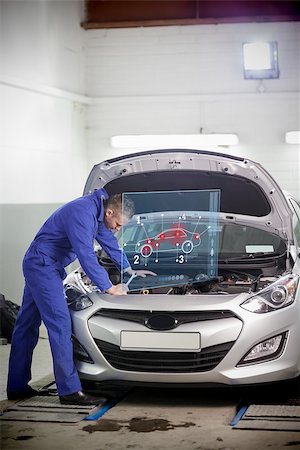 simsearch:400-06878892,k - Man repairing car with open hood and small futuristic interface with car diagram Photographie de stock - Aubaine LD & Abonnement, Code: 400-06878889