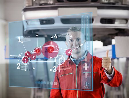 portrait young man mechanic - Portrait of smiling mechanic showing thumbs up with futurist interface with car diagram Stock Photo - Budget Royalty-Free & Subscription, Code: 400-06878892