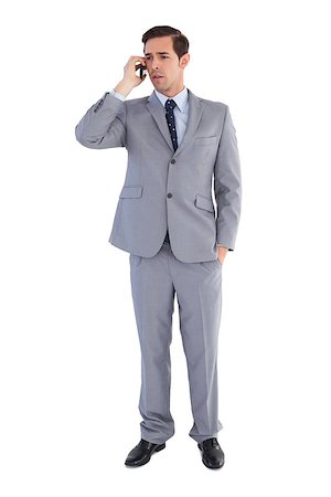 simsearch:400-07141019,k - Businessman confused while being on the phone on white background Stockbilder - Microstock & Abonnement, Bildnummer: 400-06878934