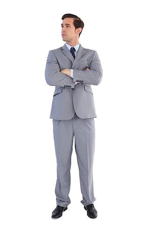 simsearch:400-07274414,k - Serious businessman with arms crossed on white background Photographie de stock - Aubaine LD & Abonnement, Code: 400-06878930