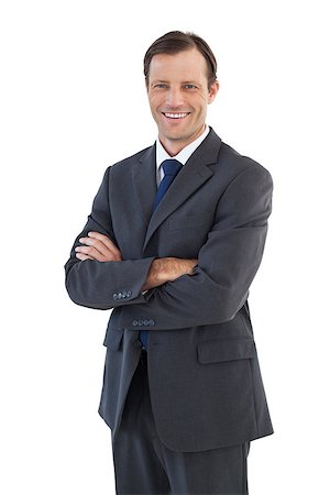 simsearch:400-07274414,k - Charismatic smiling businessman standing with arms crossed on white background Photographie de stock - Aubaine LD & Abonnement, Code: 400-06879014