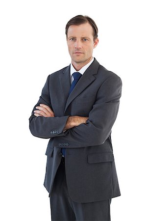 simsearch:400-07274414,k - Charismatic businessman standing with arms crossed on white background Photographie de stock - Aubaine LD & Abonnement, Code: 400-06879013