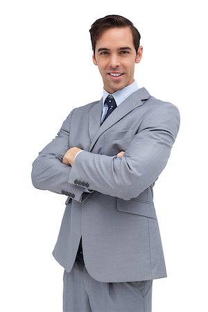 simsearch:400-07275251,k - Smiling businessman looking at camera on white background Stock Photo - Budget Royalty-Free & Subscription, Code: 400-06879030