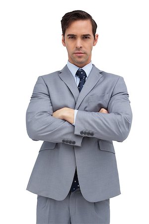 simsearch:400-07275251,k - Young businessman looking at camera on white background Stock Photo - Budget Royalty-Free & Subscription, Code: 400-06879031