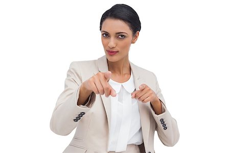simsearch:400-06883455,k - Businesswoman pointing at the camera against white background Photographie de stock - Aubaine LD & Abonnement, Code: 400-06879089