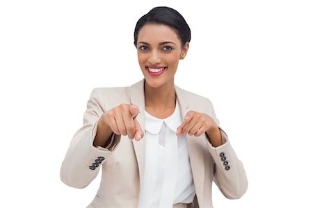 simsearch:400-06883455,k - Smiling businesswoman pointing at the camera against white background Photographie de stock - Aubaine LD & Abonnement, Code: 400-06879090