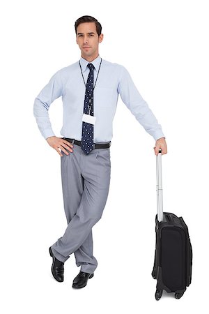 Serious businessman next to his suitcase on white background Stock Photo - Budget Royalty-Free & Subscription, Code: 400-06879229