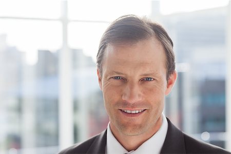 simsearch:400-06879262,k - Close up of confident businessman standing in an office Stock Photo - Budget Royalty-Free & Subscription, Code: 400-06879253