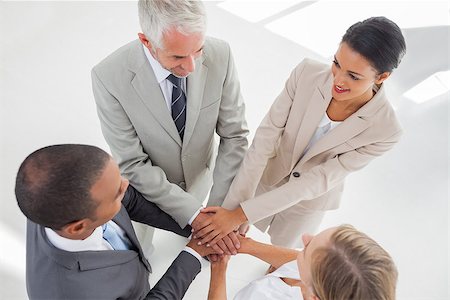 pile hands bussiness - United team standing together and piling up their hands in the workplace Stock Photo - Budget Royalty-Free & Subscription, Code: 400-06879339