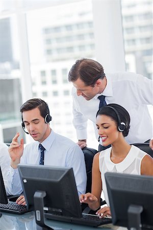 Manager taking care of employees in a call centre Stock Photo - Budget Royalty-Free & Subscription, Code: 400-06879375