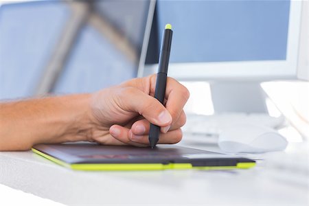 Male hands using a graphics tablet on a white desk Photographie de stock - Aubaine LD & Abonnement, Code: 400-06879842