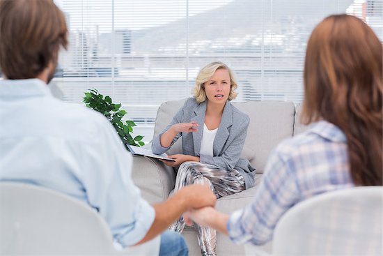 Therapist talking to a couple during a session Stock Photo - Royalty-Free, Artist: 4774344sean, Image code: 400-06879950