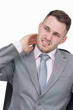 Young business man with neck pain over white background Stock Photo - Budget Royalty-Free & Subscription, Code: 400-06870369