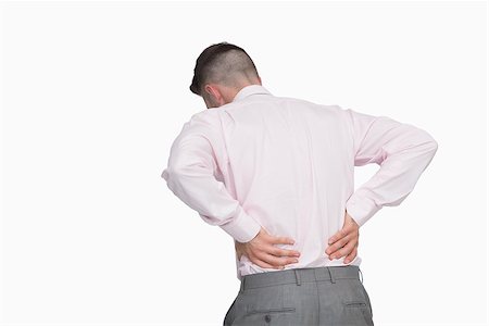 Rear view of business man with back pain over white background Foto de stock - Super Valor sin royalties y Suscripción, Código: 400-06870370