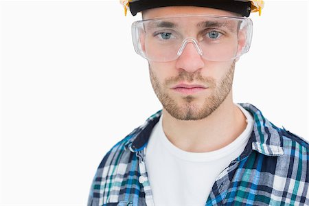 Closeup portrait of architect wearing protective eyewear over white background Stock Photo - Budget Royalty-Free & Subscription, Code: 400-06870437