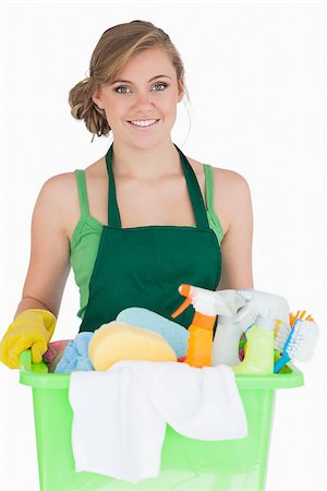 simsearch:400-06870642,k - Portrait of young maid carrying cleaning supplies over white background Stock Photo - Budget Royalty-Free & Subscription, Code: 400-06870624