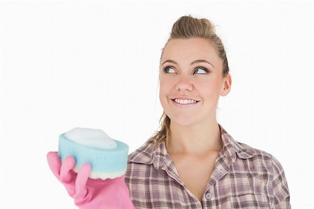 simsearch:400-06870646,k - Smiling woman holding soap suds over sponge against white background Stock Photo - Budget Royalty-Free & Subscription, Code: 400-06870623