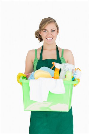 simsearch:400-06870646,k - Portrait of young maid carrying cleaning supplies over white background Stock Photo - Budget Royalty-Free & Subscription, Code: 400-06870636