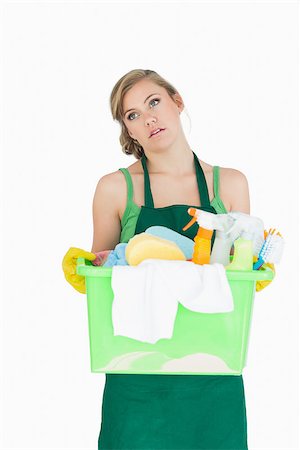 simsearch:400-06870642,k - Tied young maid carrying cleaning supplies over white background Stock Photo - Budget Royalty-Free & Subscription, Code: 400-06870637
