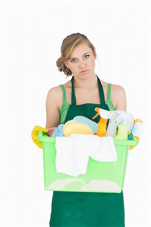 simsearch:400-06870646,k - Portrait of tied young maid carrying cleaning supplies over white background Stock Photo - Budget Royalty-Free & Subscription, Code: 400-06870638