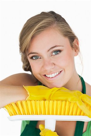 simsearch:400-06870642,k - Closeup portrait of young woman with broom over white background Stock Photo - Budget Royalty-Free & Subscription, Code: 400-06870631