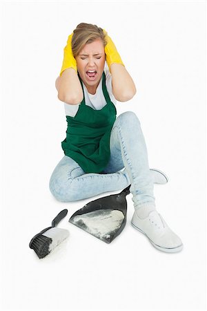 simsearch:400-06870646,k - Tired maid screaming as she sits with brush and dust pan over white background Stock Photo - Budget Royalty-Free & Subscription, Code: 400-06870646