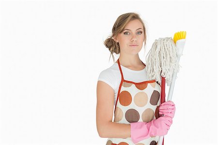 serious maid - Portrait of young woman with cleaning supplies over white background Foto de stock - Super Valor sin royalties y Suscripción, Código: 400-06870655