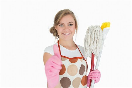 simsearch:400-06870642,k - Portrait of smiling young maid with cleaning supplies gesturing thumbs up sign over white background Stock Photo - Budget Royalty-Free & Subscription, Code: 400-06870657