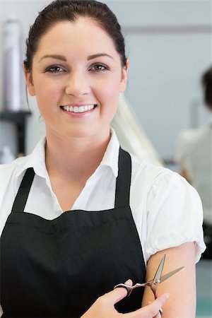 female hair stylist with apron - Closeup portrait of happy female hairdresser with hair scissors Foto de stock - Super Valor sin royalties y Suscripción, Código: 400-06870753