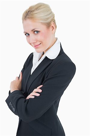 simsearch:400-05677069,k - Portrait of confident young business woman standing with arms crossed over white background Fotografie stock - Microstock e Abbonamento, Codice: 400-06870967