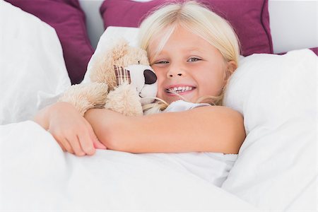 small little girl pic to hug a teddy - Little girl embracing her cuddly toy on the bed Stock Photo - Budget Royalty-Free & Subscription, Code: 400-06871469
