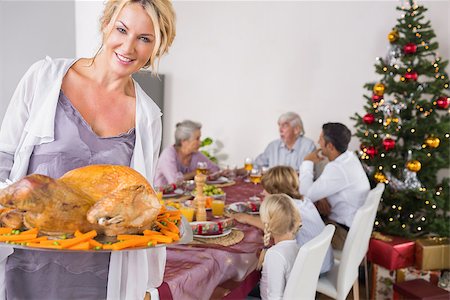 Proud mother showing roast turkey at christmas Stock Photo - Budget Royalty-Free & Subscription, Code: 400-06871551