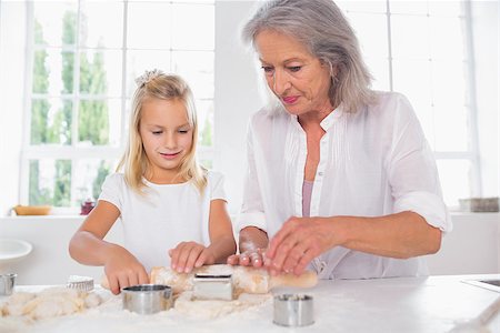 Grandmother and granddaughter making biscuits together Stock Photo - Budget Royalty-Free & Subscription, Code: 400-06871594