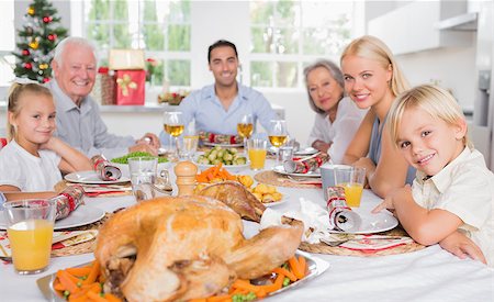 simsearch:400-06871551,k - Focus on the roast turkey in front of family at chrismas dinner Stock Photo - Budget Royalty-Free & Subscription, Code: 400-06871631