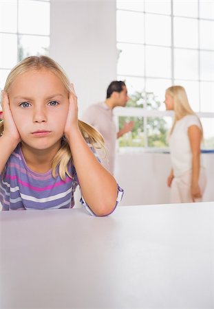 Sad girl with fighting parents in the kitchen Stock Photo - Budget Royalty-Free & Subscription, Code: 400-06871662