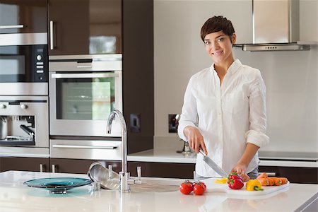 simsearch:400-06891385,k - Girl cutting vegetables in kitchen Stock Photo - Budget Royalty-Free & Subscription, Code: 400-06871766