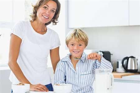 simsearch:400-06871178,k - Mother and son having breakfast in kitchen Stock Photo - Budget Royalty-Free & Subscription, Code: 400-06872762