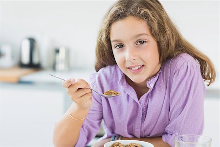 simsearch:400-06871178,k - Little girl having cereal for breakfast Stock Photo - Budget Royalty-Free & Subscription, Code: 400-06872781