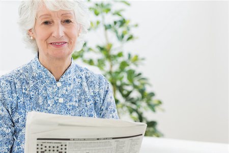 simsearch:693-06019332,k - Elderly calm woman reading newspapers on a sofa Stock Photo - Budget Royalty-Free & Subscription, Code: 400-06873121