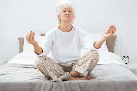 senior woman meditating - Old woman relaxing on the bed Stock Photo - Budget Royalty-Free & Subscription, Code: 400-06873191